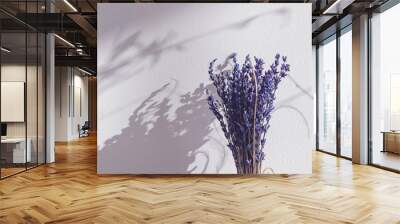 dried lavender bouquet with hands Wall mural