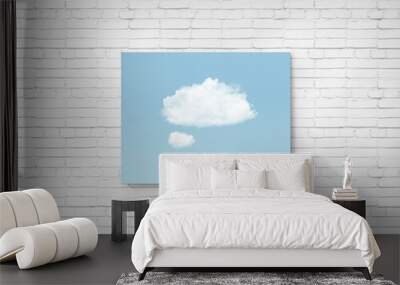 Idea creativity and thinking in blue minimal clouds background. Simple picture with cloud and blue sky on a white brick wall. Think outside the box. Surreal minimal concept. Wall mural