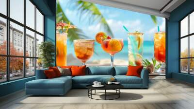 Assorted tropical cocktails on a wooden table with beach background. Wall mural