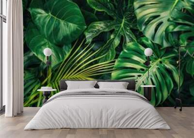 Lush green tropical leaves pattern. Wall mural