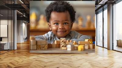 Smiling young child playing with colorful wooden blocks, early learning and education concept. International Children's Day Wall mural