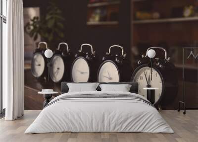 Retro alarm clocks on the table. Wall mural