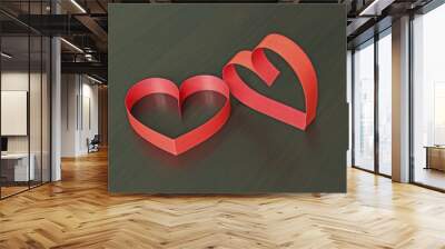 Two red hearts made of paper strips on a black wooden background Wall mural