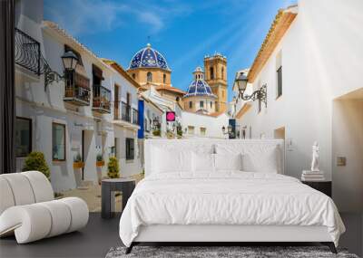 Street of Altea old town in Spain. Beautiful village with white houses and blue domed church Our Lady of Solace. Popular Spanish tourist destination, Costa Blanca region Wall mural