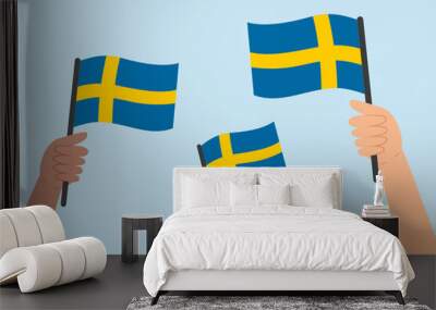 Diverse hands holding flags of Sweden. Vector illustration of Swedish flags in flat style on blue background. Wall mural