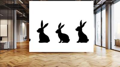 Silhouettes of Easter bunnies isolated on a white background. Set of different rabbits silhouettes for design use. Wall mural