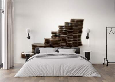 stacks of iron coins in ascending order, isolate on white background Wall mural