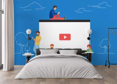 Video concept illustration of young people using mobile gadgets, tablet pc and smartphone for live watching a video via internet. Flat design of guys and women staying near big player symbol Wall mural