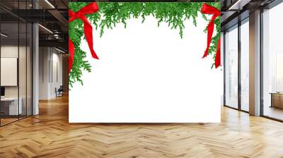 Top frame with green cedar branches with red ribbon bows isolated cutout Wall mural