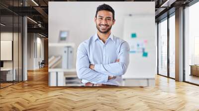 Smile, education and portrait of man teacher in a classroom or school and happy to study in a college or university. Academy, educator and young person or worker arms crossed and confident in class Wall mural