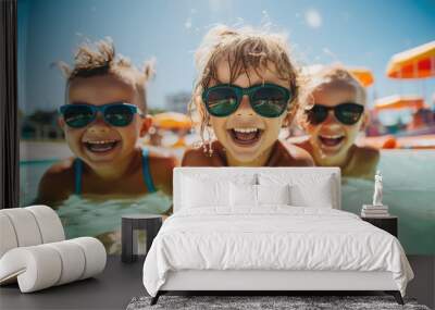 little laughing children playing in a water park, a child splashing in a summer outdoor pool, portrait, toddler, kid, person, entertainment, vacation, emotional face, smile, joy, happiness Wall mural