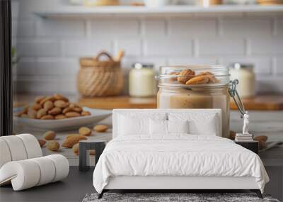 nut butter in a glass jar on the table on the background of a white kitchen, almond, urbech, chocolate, healthy eating, shell, food, meal, nutritious, creamy, sweet, dessert Wall mural