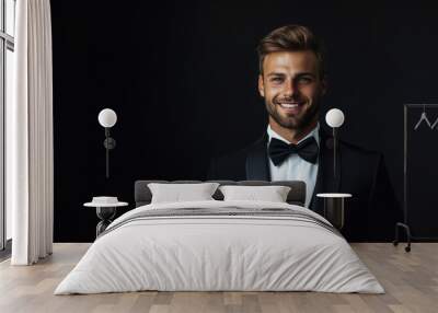 young attractive handsome smiling man in tuxedo with bow tie on black background, rich person, guy portrait, evening outfit, festive wear, model, male, signor, dandy, tailcoat, jacket, fashion, style Wall mural