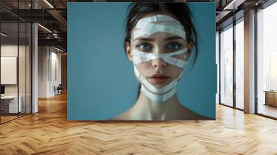 young woman with tapes on her face, beauty salon, facelift, laser, beautiful girl, portrait, cosmetology, people, person, emotional, makeup, fashion, youth, skin care Wall mural