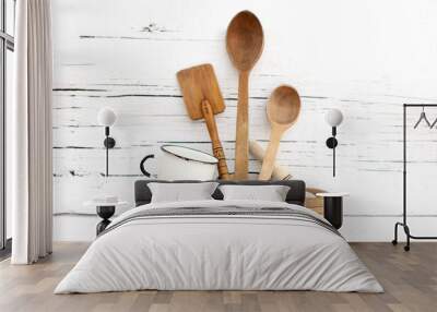 Vintage old kitchen utensils on a white wooden background. Wall mural