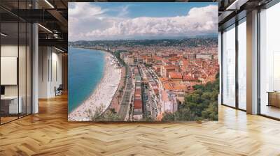 Panorama photo of the public baths Plage de Castel and Plage des Ponchettes in the French city of Nice with the well known promenade quai des etats Unis along Wall mural