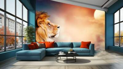 African lion and sunset in Africa. Savannah landscape theme, king of animals. Spectacular warm sun light and dramatic red cloudy sky. Proud dreaming fantasy leo in savanna looking forward. Wall mural