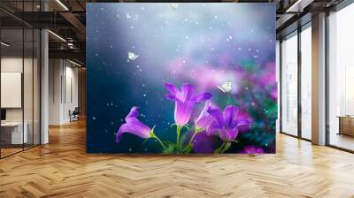 Bluebells Flowers in Fantasy magical garden in enchanted fairy tale elf Forest, fairytale blue bells glade and butterflies on midnight background, elven magic woods in dark night with moon rays light. Wall mural