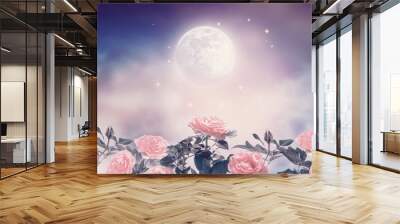 Fairytale fantasy photo background of magical deep blue dark night sky with shining stars, glowing full moon and beautiful fairy pink rose flower garden. Idyllic tranquil fabulous panoramic scene. Wall mural