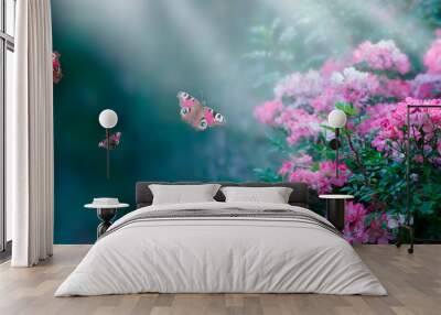 Mysterious fairytale spring or summer fantasy floral wide banner with rose flowers blossom, flying peacock eye butterflies on blurred beautiful background toned in bright colors and shining sun beam Wall mural