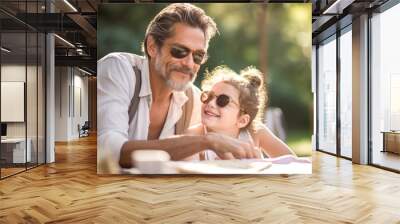 Happy dad with daughter on Father's Day enjoying a picnic in the park during late afternoon light in the park. Fathers Day concept, dads love, relationships between father and child. Generative Ai Wall mural