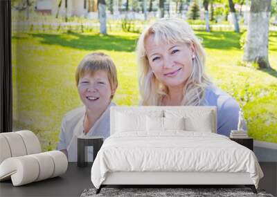 blond woman and son smiling in the summer Wall mural