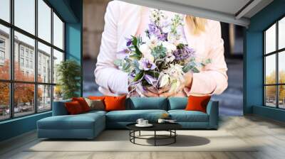 Beautiful bouquet with delicate flowers. Pink-white-purple bouquet. Bridal bouquet in female hands Wall mural