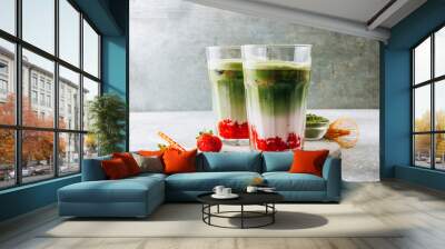 Summer strawberry matcha latte with ice in a glass cup Wall mural