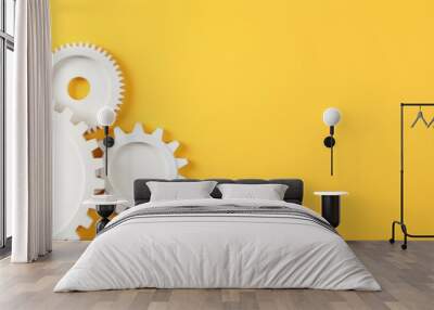 Three white gears on a Yellow background, laid flat, copy space concept for business technology and development in the abstract vector with copy space  Wall mural