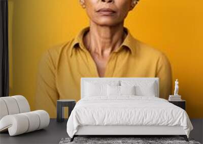 Yellow background sad black American independent powerful Woman. Portrait of older mid-aged person beautiful bad mood expression girl Isolated Wall mural