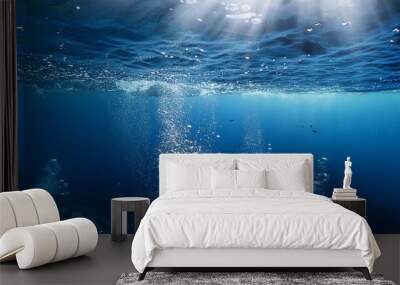 Underwater view with bubbles rising to the surface in a deep blue ocean. The image captures the serenity and mystery of the underwater world Wall mural