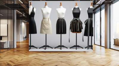 Collection of mannequins showcasing a variety of stylish dresses on a neutral background Wall mural