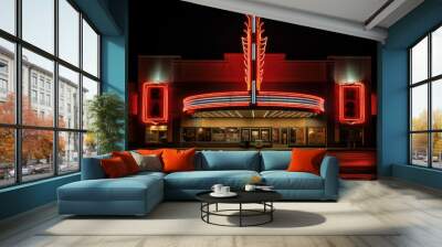 Illuminated art deco movie theater exterior with neon lights under the night sky Wall mural