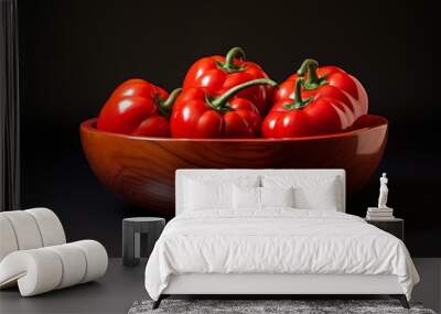 Ripe red tomatoes in a polished wooden bowl against a dark, elegant backdrop Wall mural