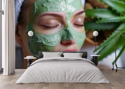 Woman is getting a treatment with aloe vera extract applied by a beautician Wall mural