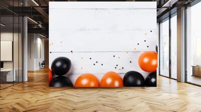 Black and orange balloons and confetti for Halloween card or invitation. Flat lay. Wall mural