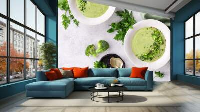 Broccoli green soup with fresh parsley. Healthy and diet vegan dish. Top view on stone table. Wall mural