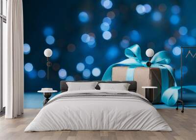 Christmas gift box or present with bow ribbon on magic blue bokeh background. Copy space for greeting card. Wall mural