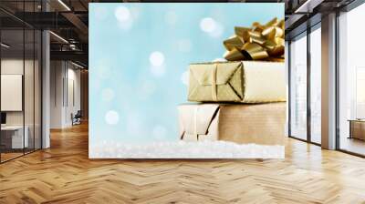 Golden gifts or presents boxes on magic bokeh background. Holiday composition for Christmas or New Year. Wall mural