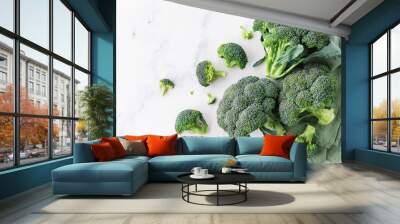 Heap of fresh green broccoli on stone table top view. Wall mural