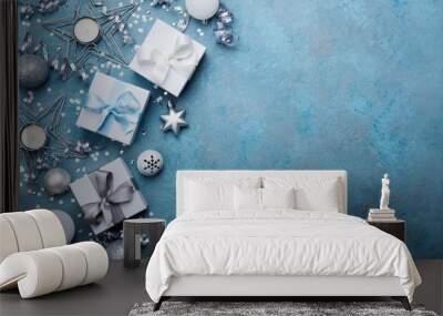 Holiday background with christmas decoration and gift boxes top view. Festive greeting card. Flat lay style. Wall mural