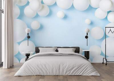 Pastel blue table with white balloons top view. Party or birthday background. Flat lay. Wall mural