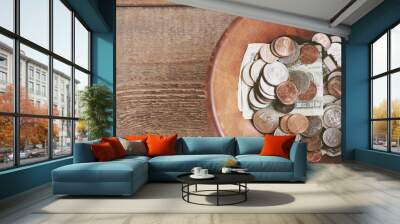 Dollars and change in a bowl Wall mural