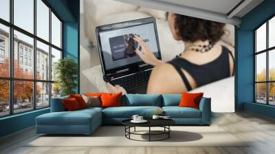 Woman, laptop and anorexia information or diet, health and person working online from living room couch. Computer, peer pressure and body in media or remote, job in technology and work at home Wall mural