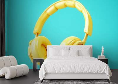 3D Rendering Yellow headphones isolated on blue background Wall mural