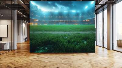 a vibrant soccer stadium comes alive under bright floodlights with the lush grassy pitch glowing in the night capturing the thrilling atmosphere of a live sports event Wall mural