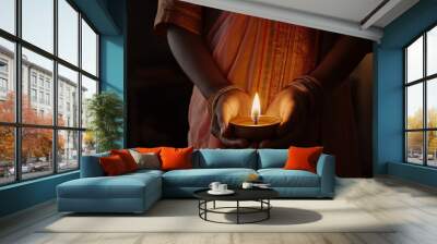 Hands Holding Diya Lamp in Traditional Attire for Diwali Festival Wall mural