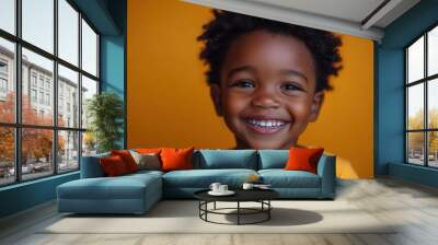 joyful african american boy laughing vibrant orange background expressive portrait genuine happiness Wall mural