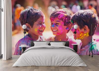 Kids smearing colour powder to each other face during holi celebration, Celebrating Holi festival. Soft focus Wall mural