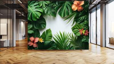 lush tropical frame of exotic leaves and flowers on white background creating botanical border with vivid greens and pops of color Wall mural